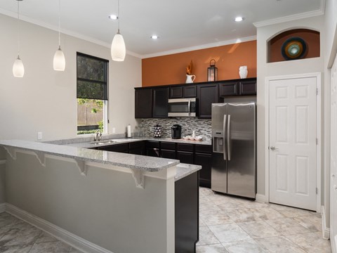 a kitchen with stainless steel appliances and granite counter tops